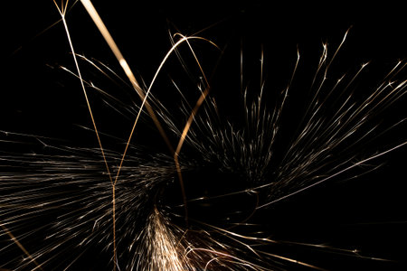 sparks from the grinder glowing in the dark