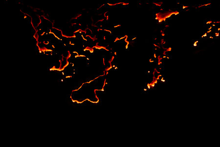 burning paper, glowing edge of paper on a black backgroundの写真素材
