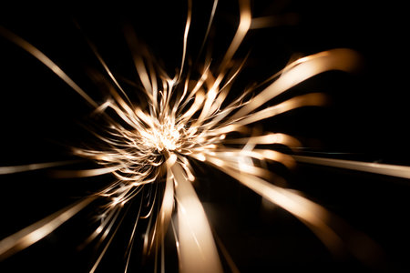 sparks from the grinder glowing in the dark straight aheadの写真素材