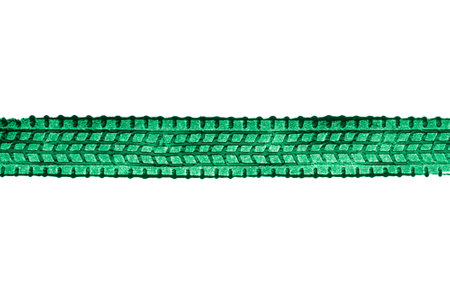 green traces of tractor tires on white backgroundの写真素材
