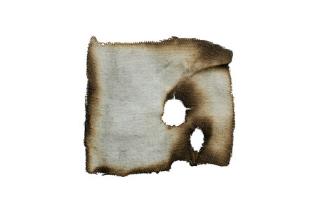 a piece of burnt rag on a white backgroundの写真素材