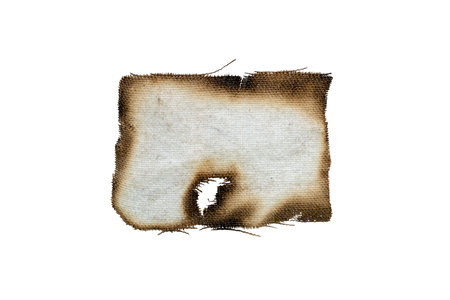 a piece of burnt rag on a white backgroundの写真素材