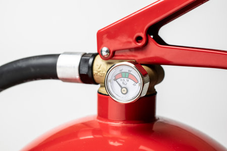 fire extinguisher. close-up of valve and pressure gaugeの写真素材