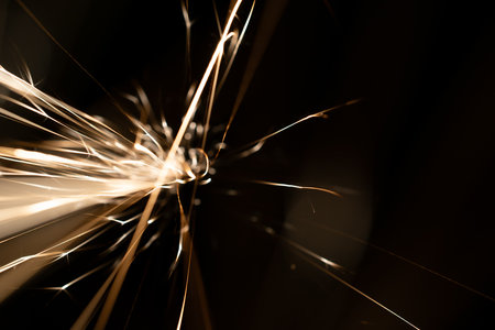 sparks from the grinder glowing in the dark straight ahead