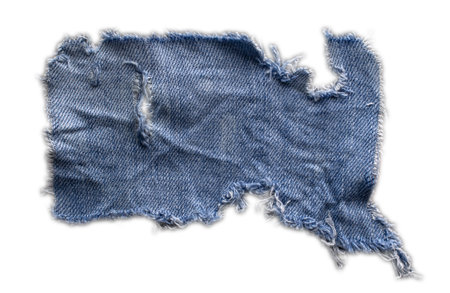 jeans. a frayed and torn piece of denim rag