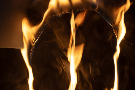 burning plastic close up, plastic is burning, melts and drips