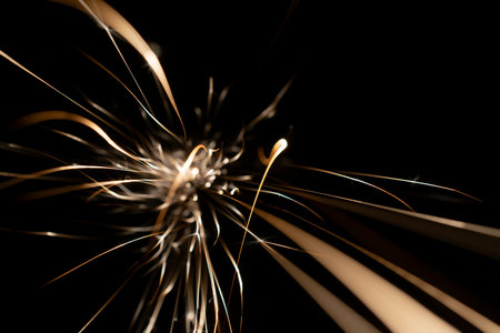 sparks from the grinder glowing in the dark straight aheadの写真素材