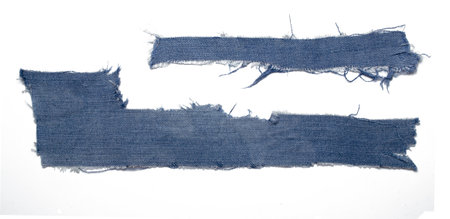 a frayed and torn piece of denim ragの写真素材