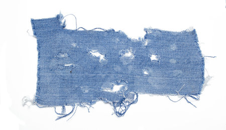 jeans. a frayed and torn piece of denim ragの写真素材