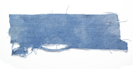jeans. a frayed and torn piece of denim ragの写真素材