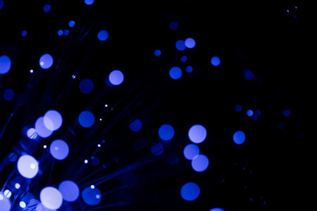 Fiber optical cables glowing blue. bokeh light spots