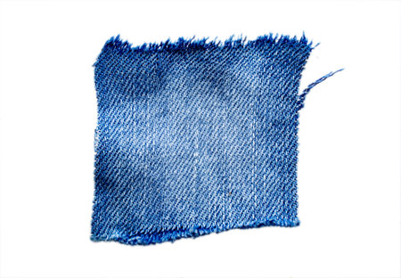 jeans. a frayed and torn piece of denim rag