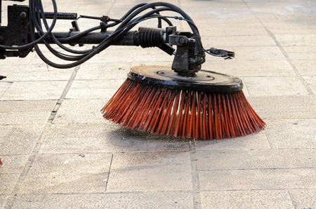 Vehicle sweeping the streets of dirt in the Spain