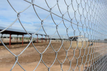 Solid metallic mesh, fence close up in outの写真素材