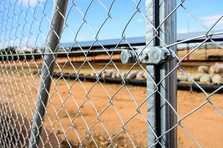 Solid metallic mesh, fence close up in outの写真素材