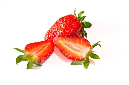 Strawberries with leaves. Isolated on a white background.の写真素材