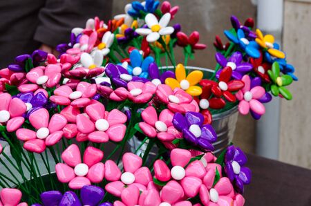 Bouquet with batterflies made from jelly candies in marketの写真素材