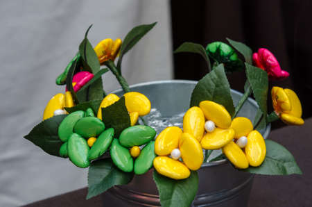 Bouquet with batterflies made from jelly candies in marketの写真素材