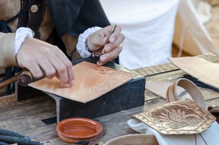 work table with old tools of the artisan shoemakerの写真素材