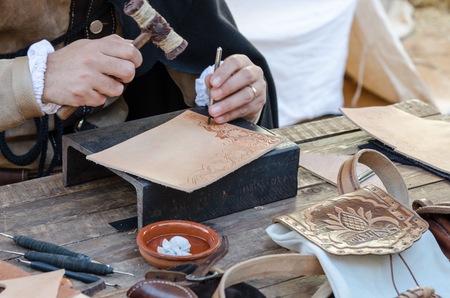 work table with old tools of the artisan shoemakerの写真素材