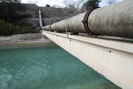 Pipes above the water channel in the Spainの写真素材