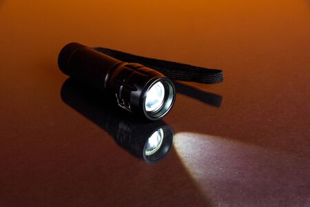 LED flashlight in backgrounの写真素材
