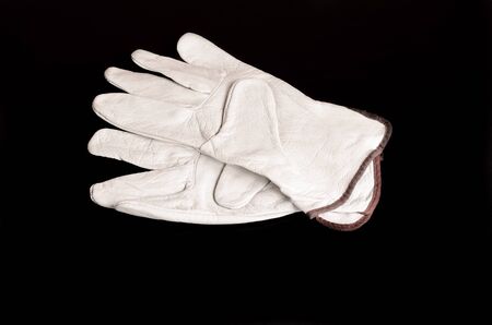 Leather work gloves on backgroundの写真素材