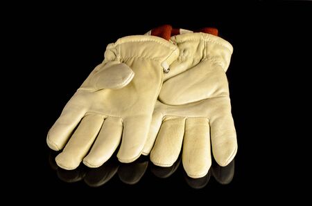 Leather work gloves on backgroundの写真素材