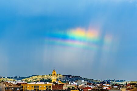 Double rainbow in villageの写真素材