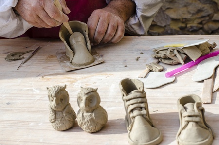 Artist man hands working clayの写真素材