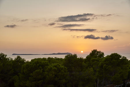 Balearic sunset from La Savina in Formentera with Es Vedra of Ibiza in backgroundの写真素材