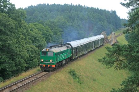 Passenger train passing through polish countrysideの写真素材
