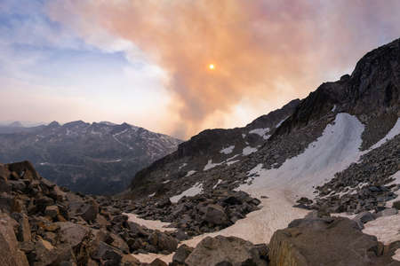Beautiful view from Keyhole hike in Kokanee Glacier National Park, British Columbia, Canada. View of mountains, glaciers and wildfire smoke during sunset.の写真素材