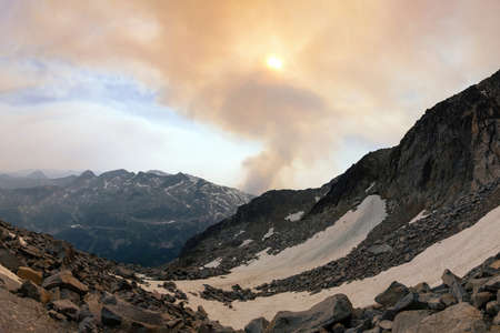 Beautiful view from Keyhole hike in Kokanee Glacier National Park, British Columbia, Canada. View of mountains, glaciers and wildfire smoke during sunset.の写真素材