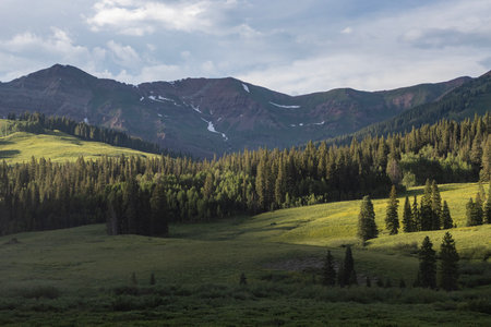 Amazing scenery. Mountain and valleys provide unbeatable natural scene. Summer colors with some snow still peaking out here and there.の写真素材