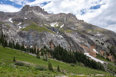 Amazing scenery. Mountain and valleys provide unbeatable natural scene. Summer colors with some snow still peaking out here and there.の写真素材
