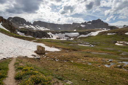 Amazing scenery. Mountain and valleys provide unbeatable natural scene. Summer colors with some snow still peaking out here and there.の写真素材