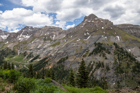 Amazing scenery. Mountain and valleys provide unbeatable natural scene. Summer colors with some snow still peaking out here and there.の写真素材