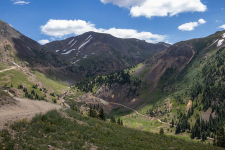 Amazing scenery. Mountain and valleys provide unbeatable natural scene. Summer colors with some snow still peaking out here and there.の写真素材
