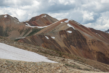 Amazing scenery. Mountain and valleys provide unbeatable natural scene. Summer colors with some snow still peaking out here and there.の写真素材