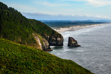 A breathtaking view showcasing rugged cliffs meeting the ocean, with sandy beaches extending into...