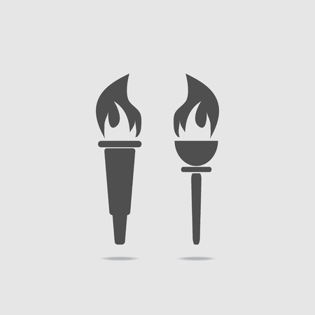Set of two torches with fire. On a light background, in gray. Icon torch. Vector illustration.のイラスト素材