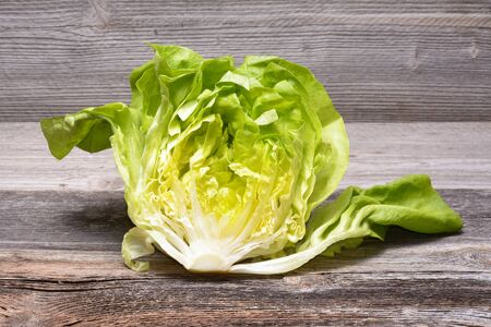 Fresh lettuce on wooden tableの写真素材