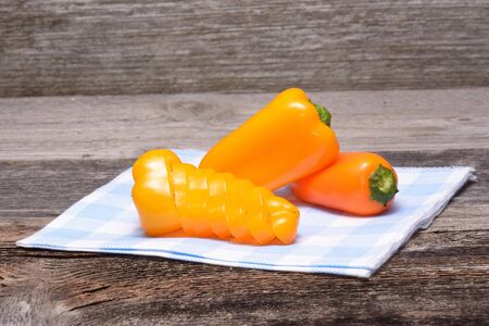 Fresh colorful capsicum on a wooden backgroundの写真素材