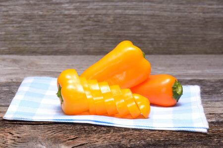 Fresh colorful capsicum on a wooden backgroundの写真素材