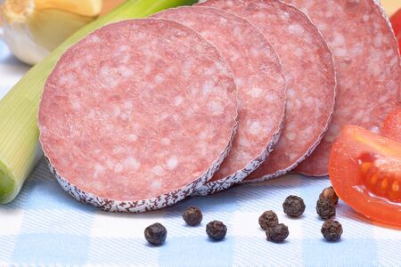 Salami sausage on wooden tableの写真素材