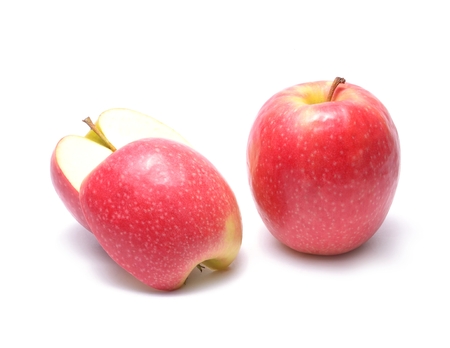 Sweet apple with slice isolated on whiteの写真素材