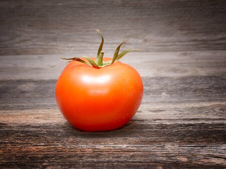 Fresh tomatoes on wooden backgroundの写真素材