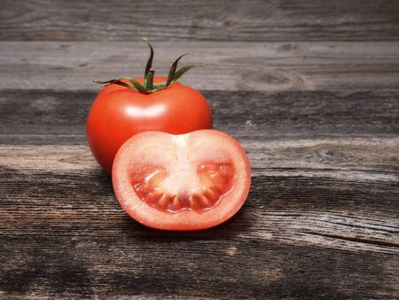 Fresh tomatoes on wooden backgroundの写真素材