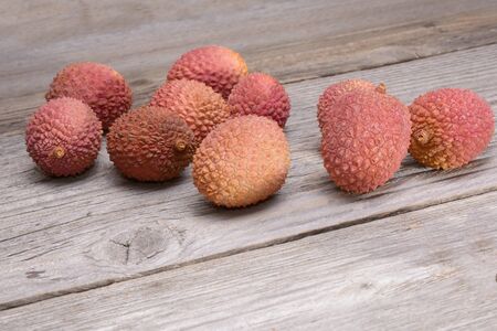 Lychee group arranged on a wooden tableの写真素材